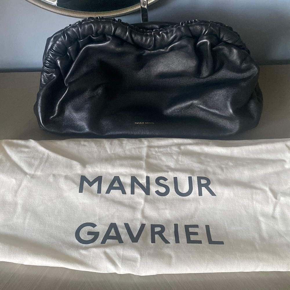 Mansur Gavriel cloud clutch in black leather with red leather interior